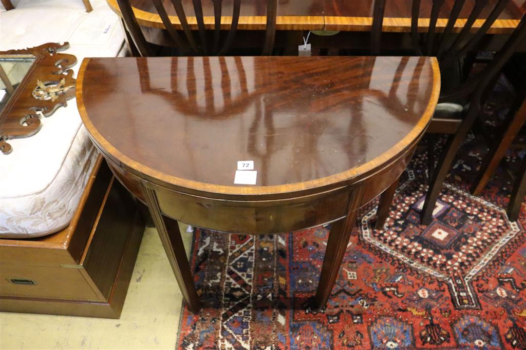 A George III mahogany demi-lune tea table